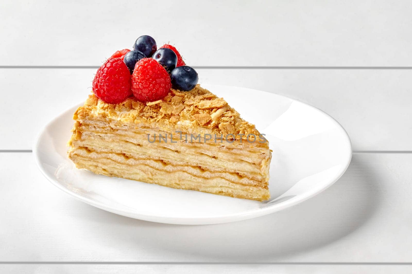 Mille feuille cake with butter pastry cream and fresh berries by nazarovsergey