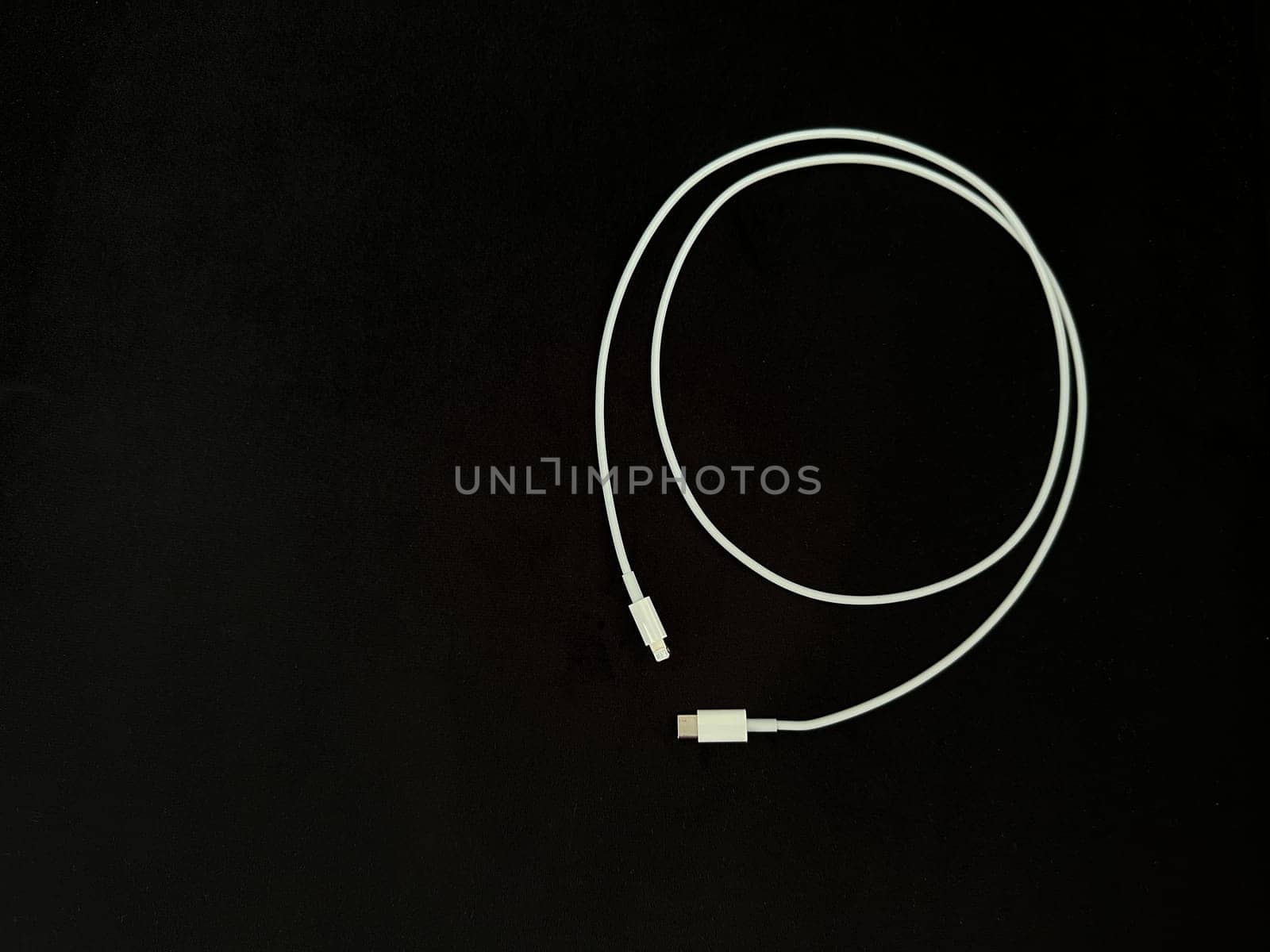 Charging wire Type C on a black background. High quality photo