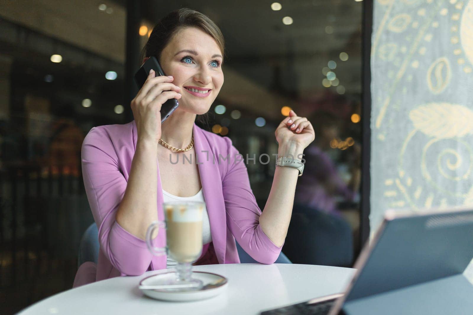 Portrait of a young business woman talking on the phone, got a good deal or promotion.