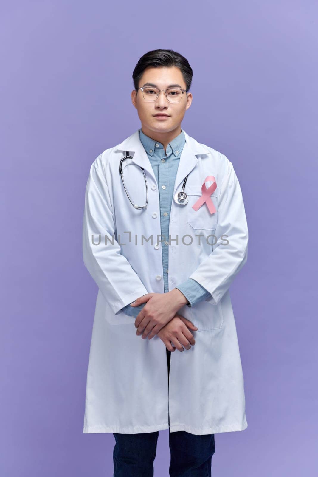 Doctor with pink ribbon on his chest,