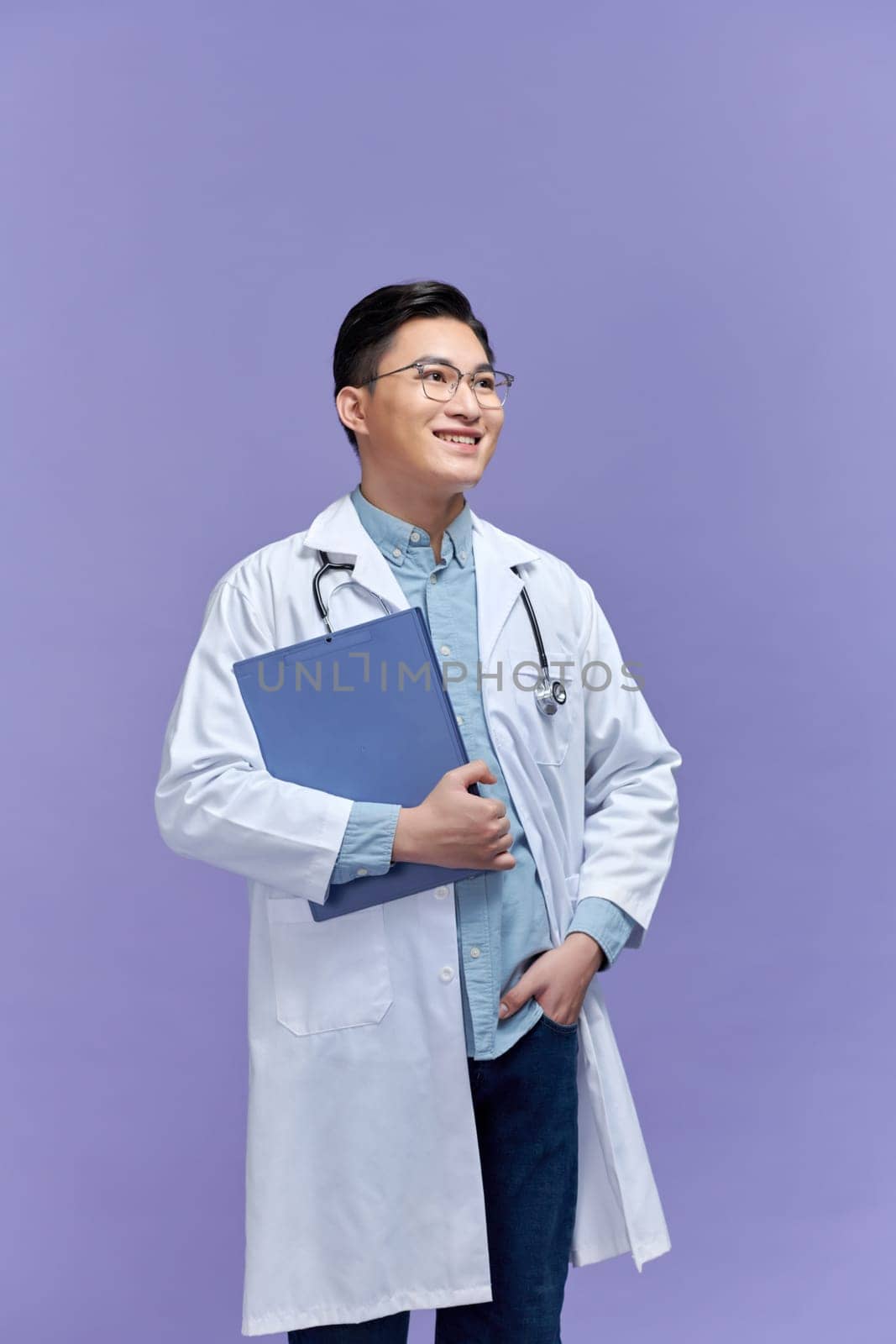 Asian male doctor portrait on purple background by makidotvn