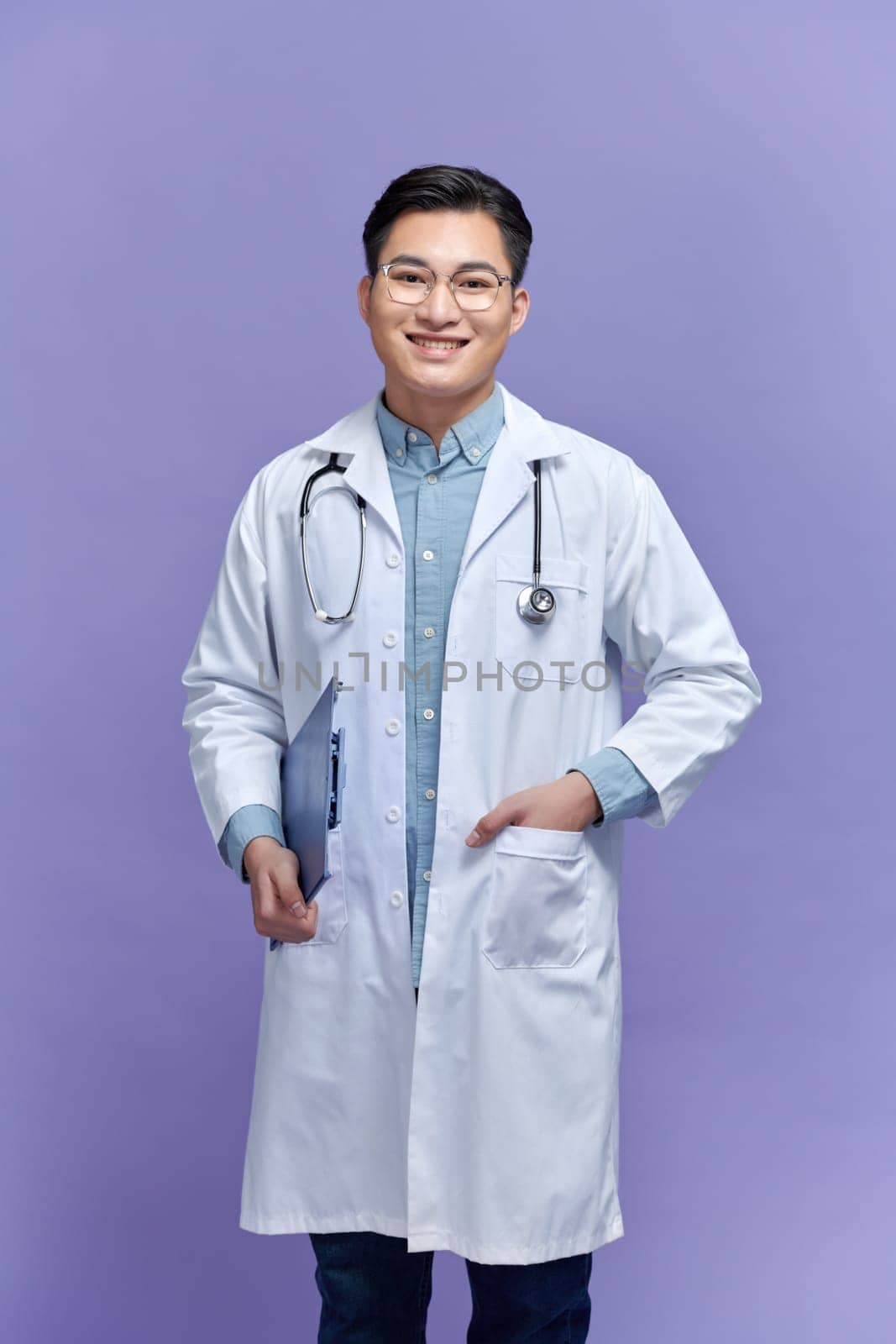 Male Doctor standing with folder, isolated on white background by makidotvn