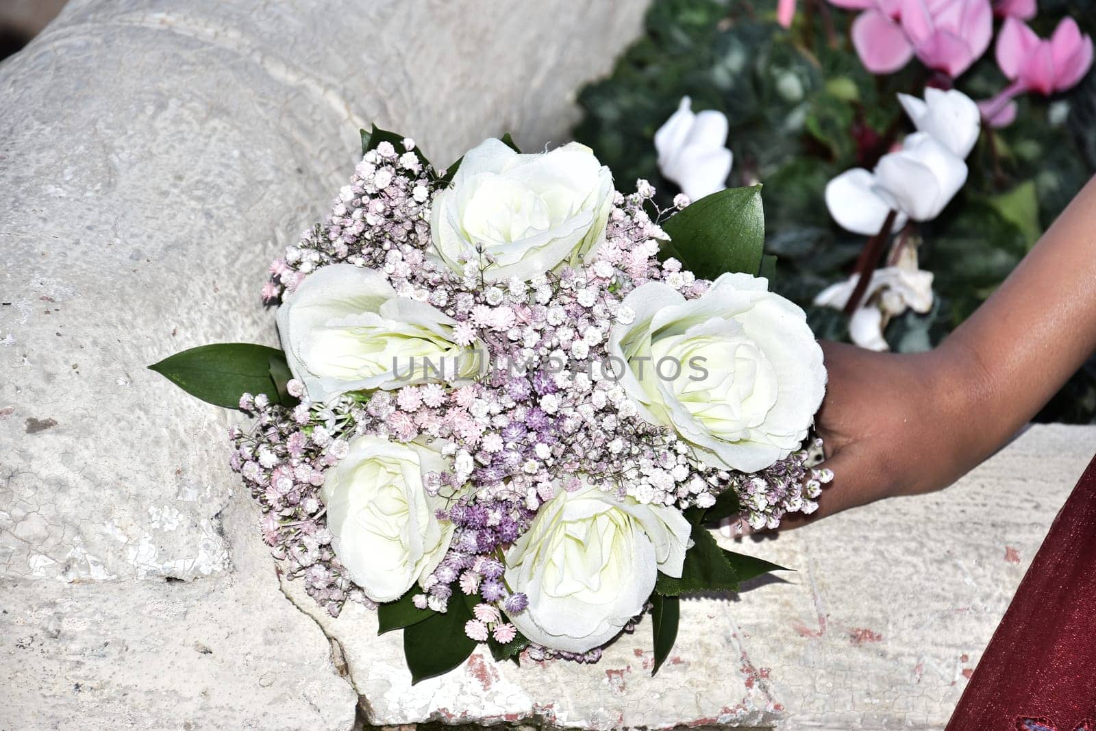 wedding bouquet of white and pink flowers in the bride's hand. High quality photo