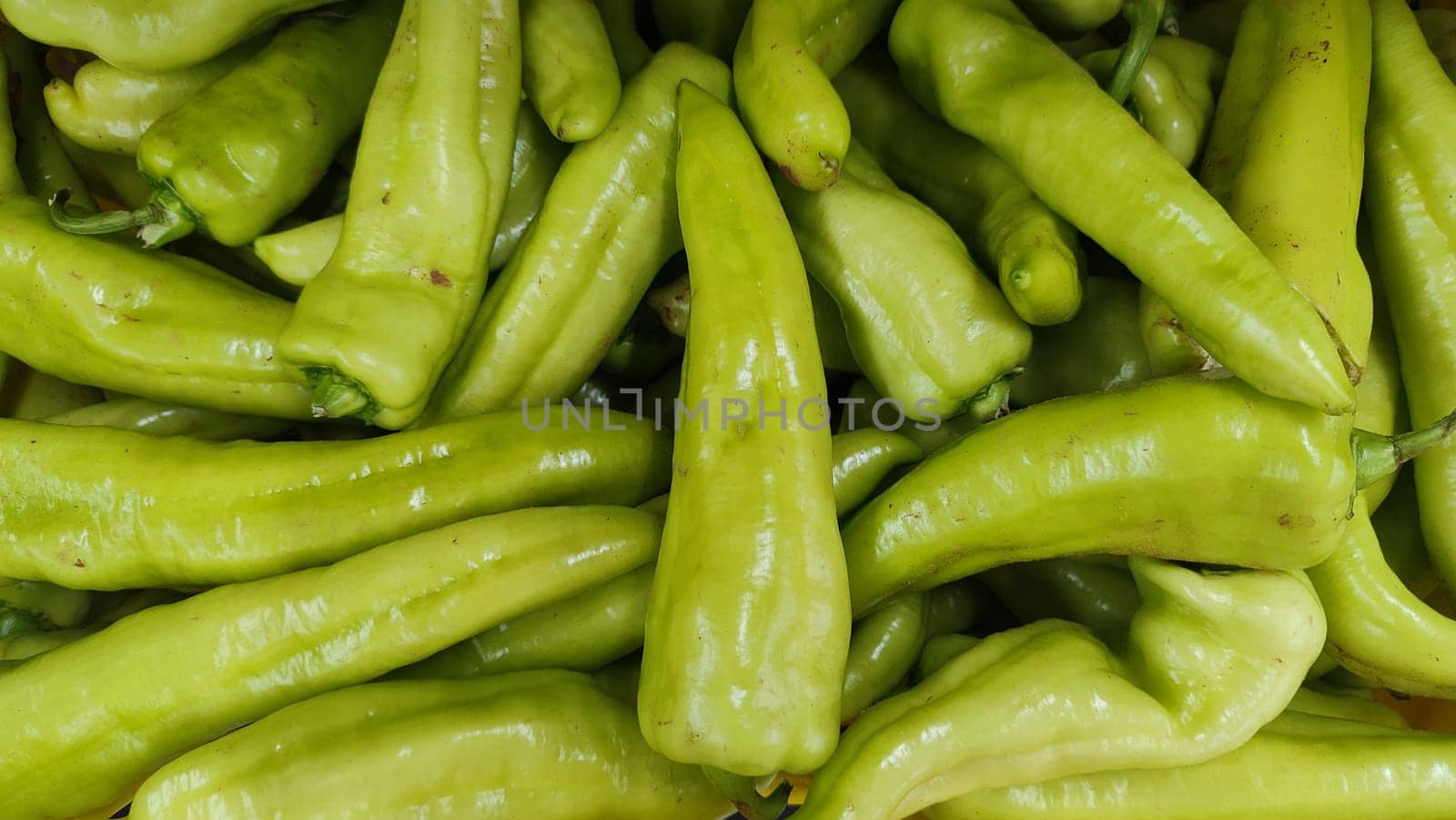 green hot peppers, vegetables food in store background. High quality photo