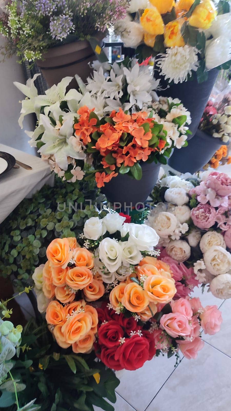 orange and white roses, artificial ornamental plants. High quality photo