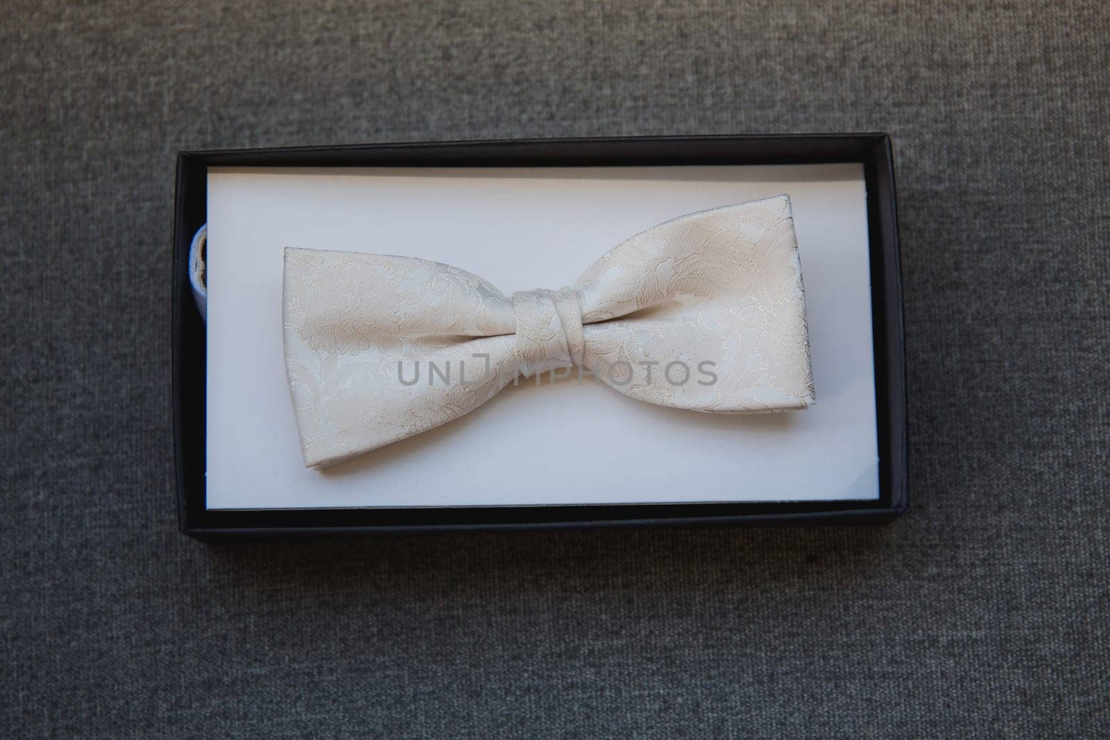 Men's bow tie in the cardboard box. Close-up. Top view. by leonik