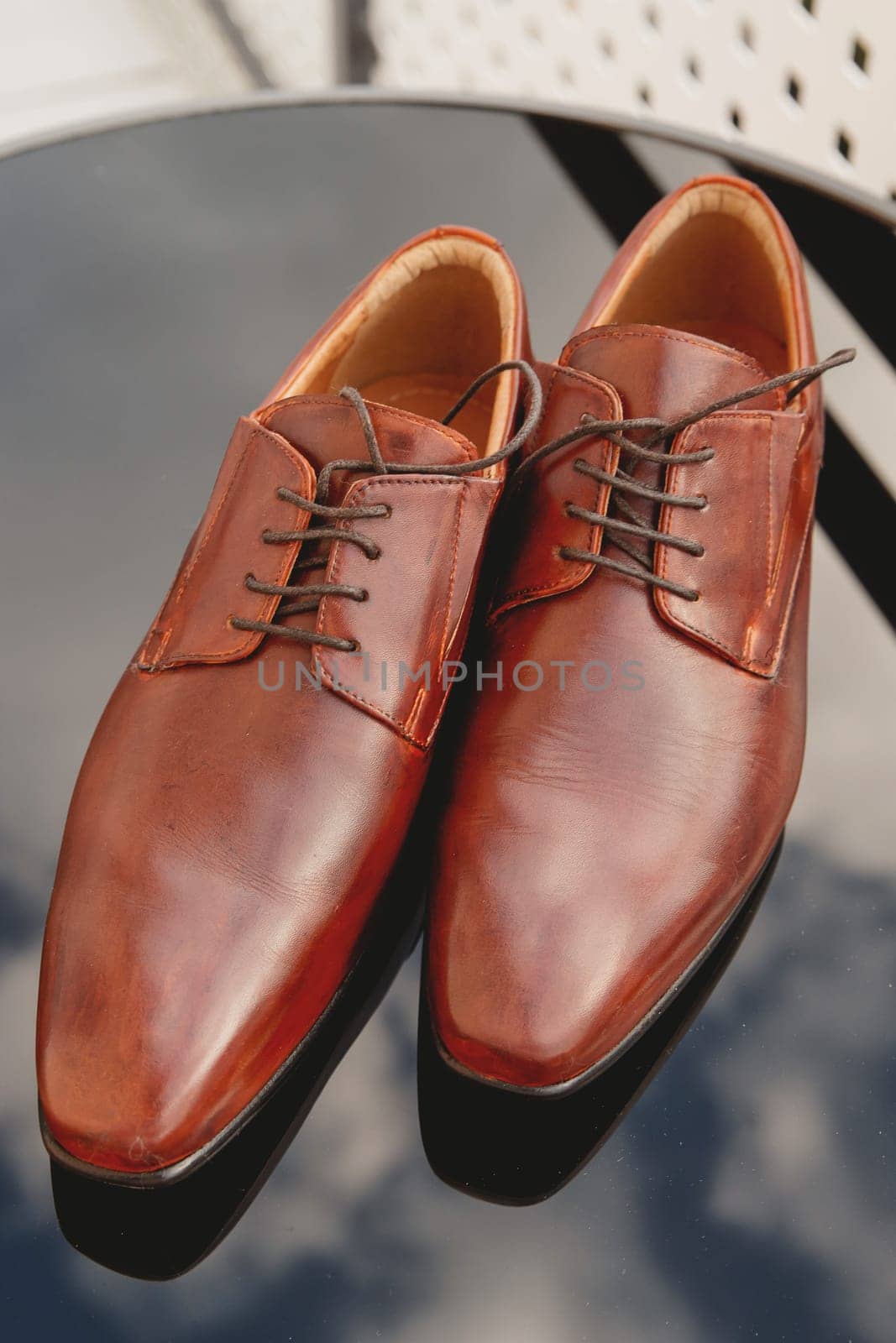 Men's shoes, groom's wedding shoes. Set groom accessories. Soft focus. by leonik