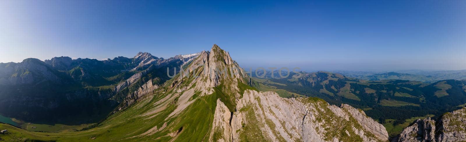 Schaefler Altenalptuerme mountain ridge swiss Alpstein alpine Appenzell Innerrhoden Switzerland, a steep ridge of the majestic Schaefler peak in the Alpstein mountain range Appenzell, Switzerland with the fog covering the Seealpsee valley.