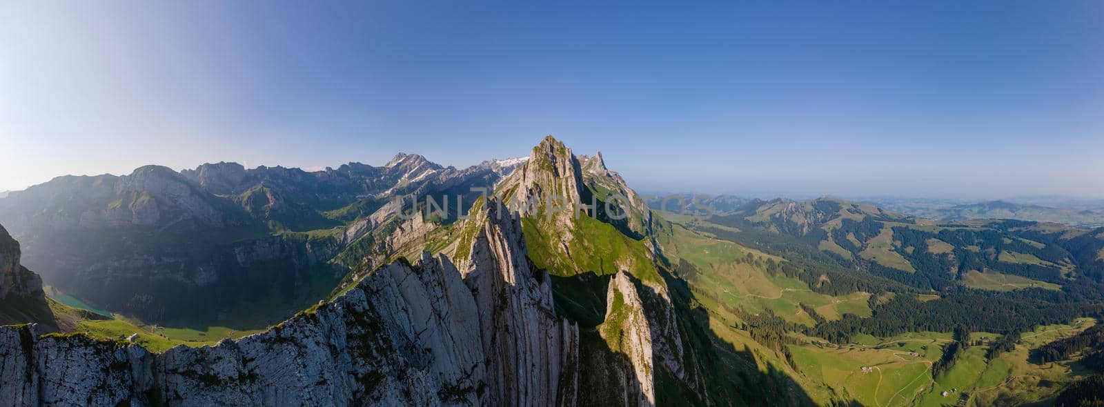 Schaefler Altenalptuerme mountain ridge swiss Alpstein alpine Appenzell Innerrhoden Switzerland,steep ridge of the majestic Schaefler peak in the Alpstein mountain range Appenzell, Switzerland with the fog covering the Seealpsee valley by fokkebok