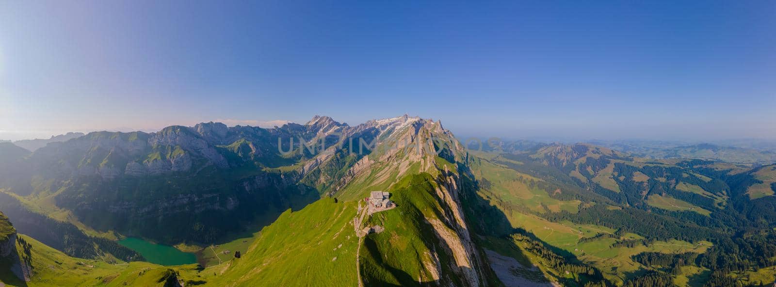 Schaefler Altenalptuerme mountain ridge swiss Alpstein alpine Appenzell Innerrhoden Switzerland, a steep ridge of the majestic Schaefler peak in the Alpstein mountain range Appenzell, Switzerland with the fog covering the Seealpsee valley.