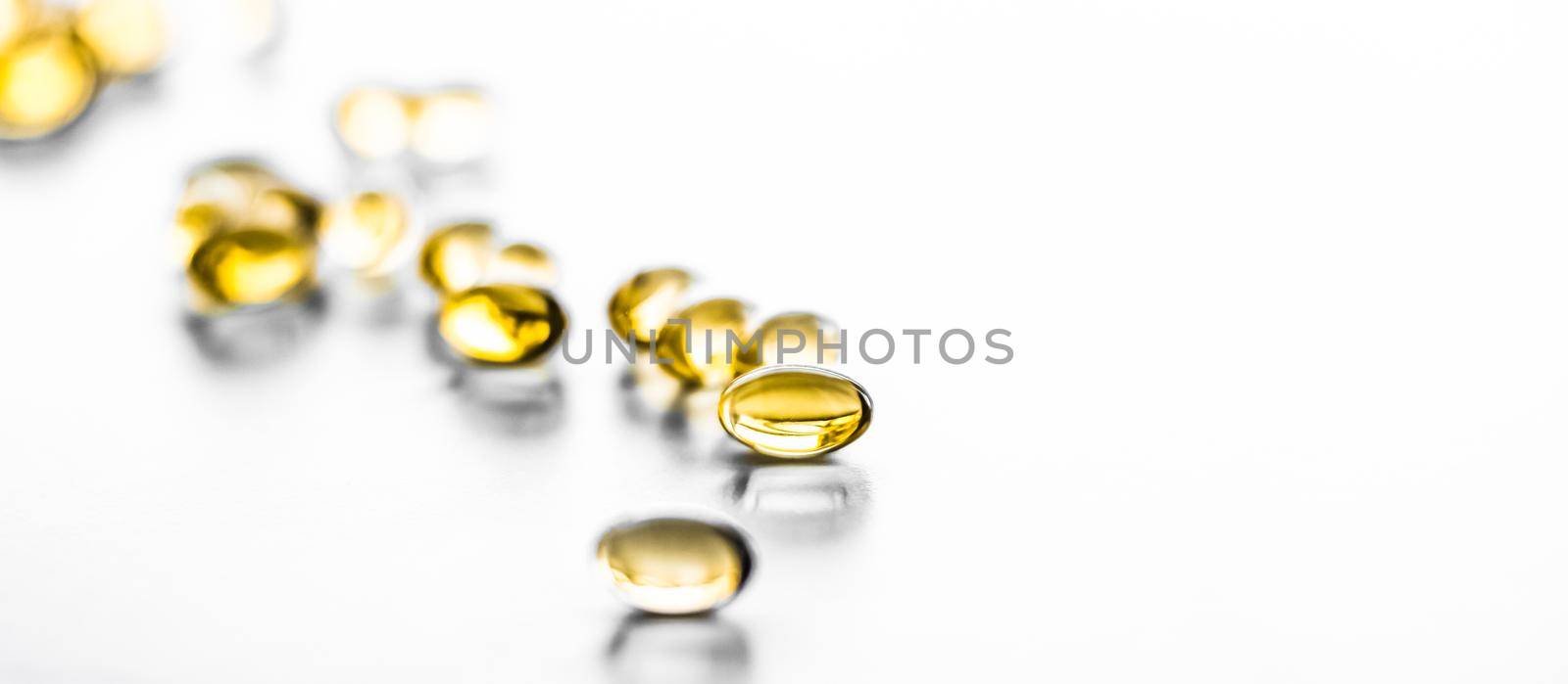 Pharmaceutical, branding and science concept - Vitamin D and golden Omega 3 pills for healthy diet nutrition, fish oil food supplement pill capsules, healthcare and medicine as pharmacy background