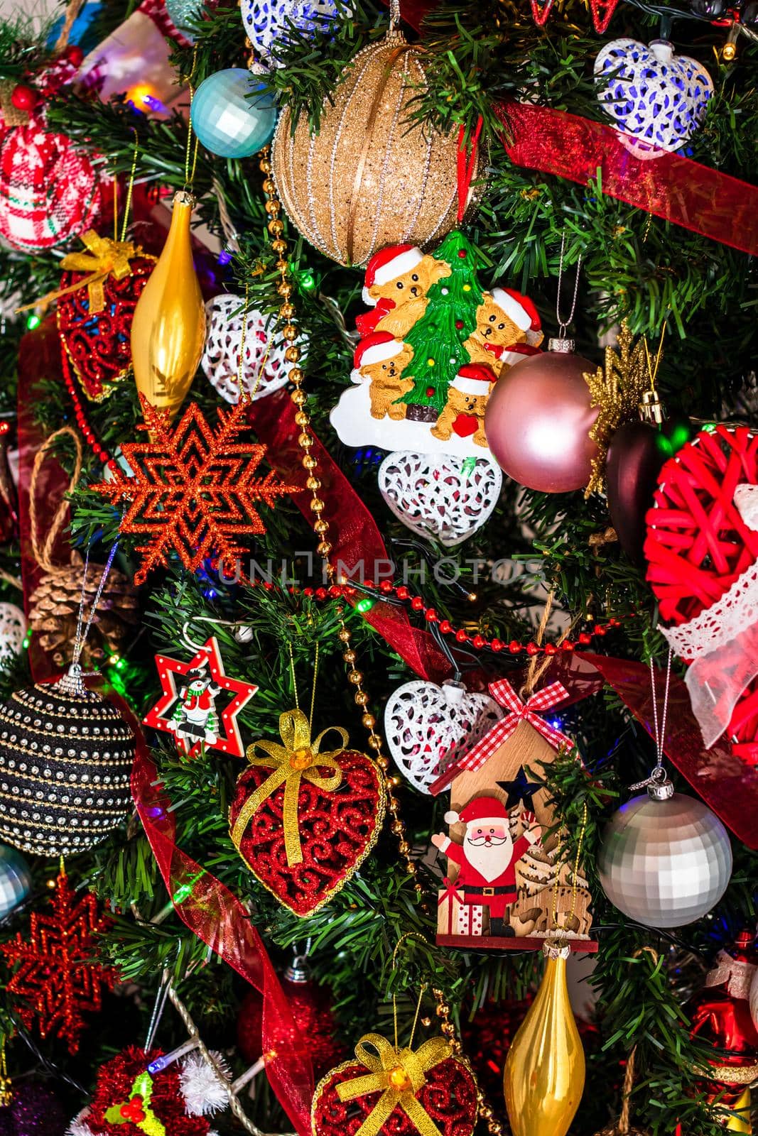 Beautiful Christmas ornaments and decorations hanging in the Christmas tree by vladispas