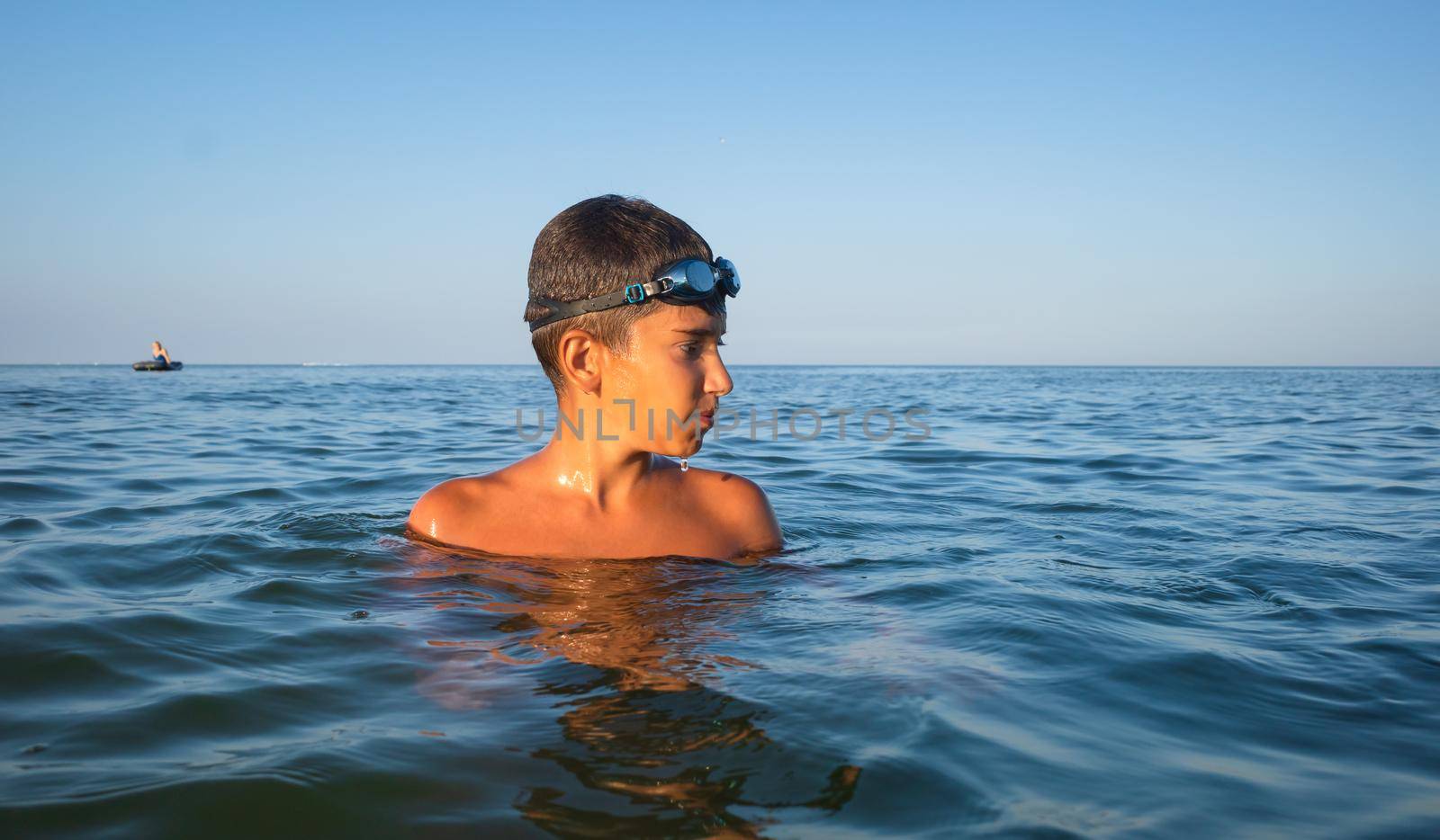  boy bathes in the sea by palinchak