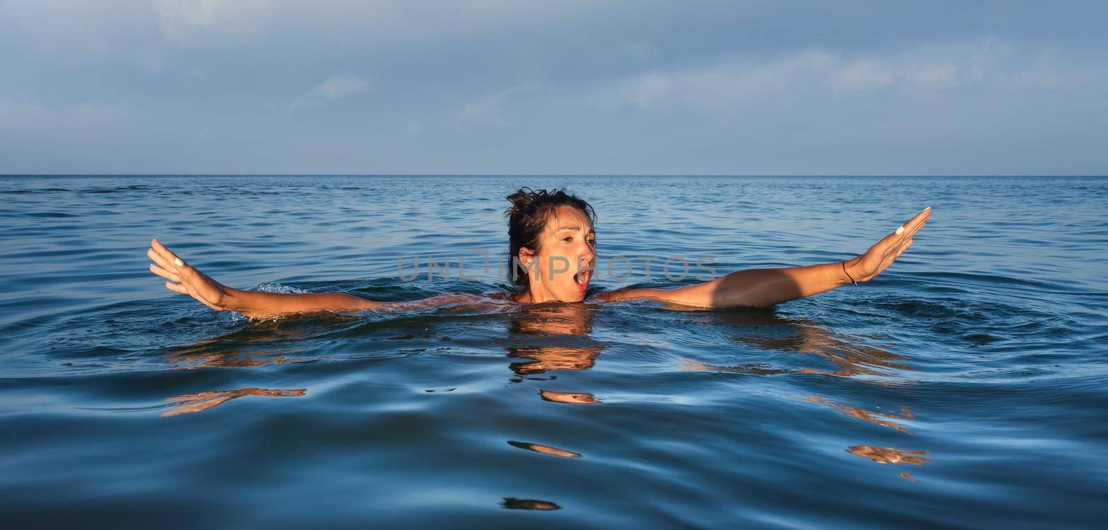 woman swims in the sea by palinchak