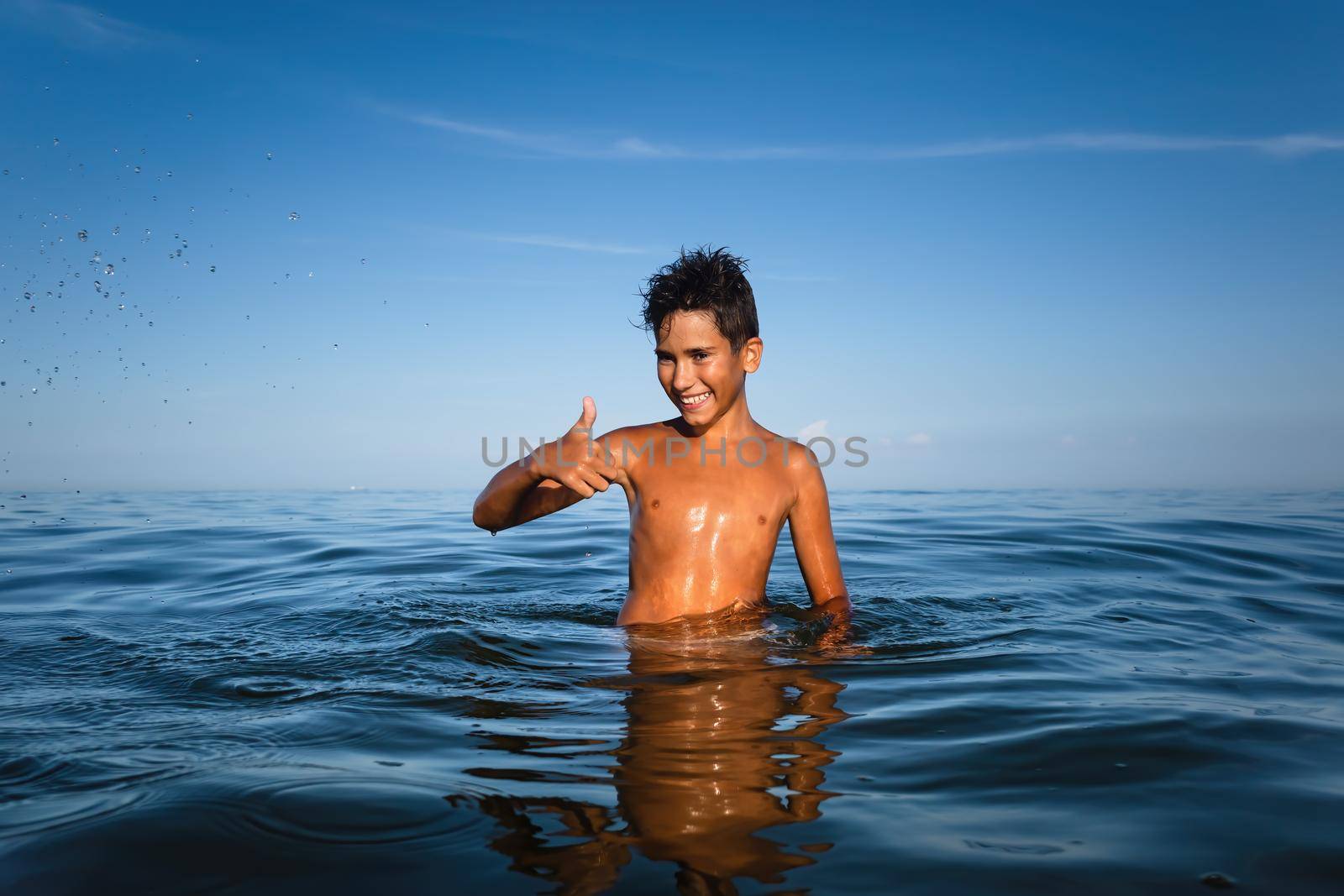  boy bathes in the sea by palinchak