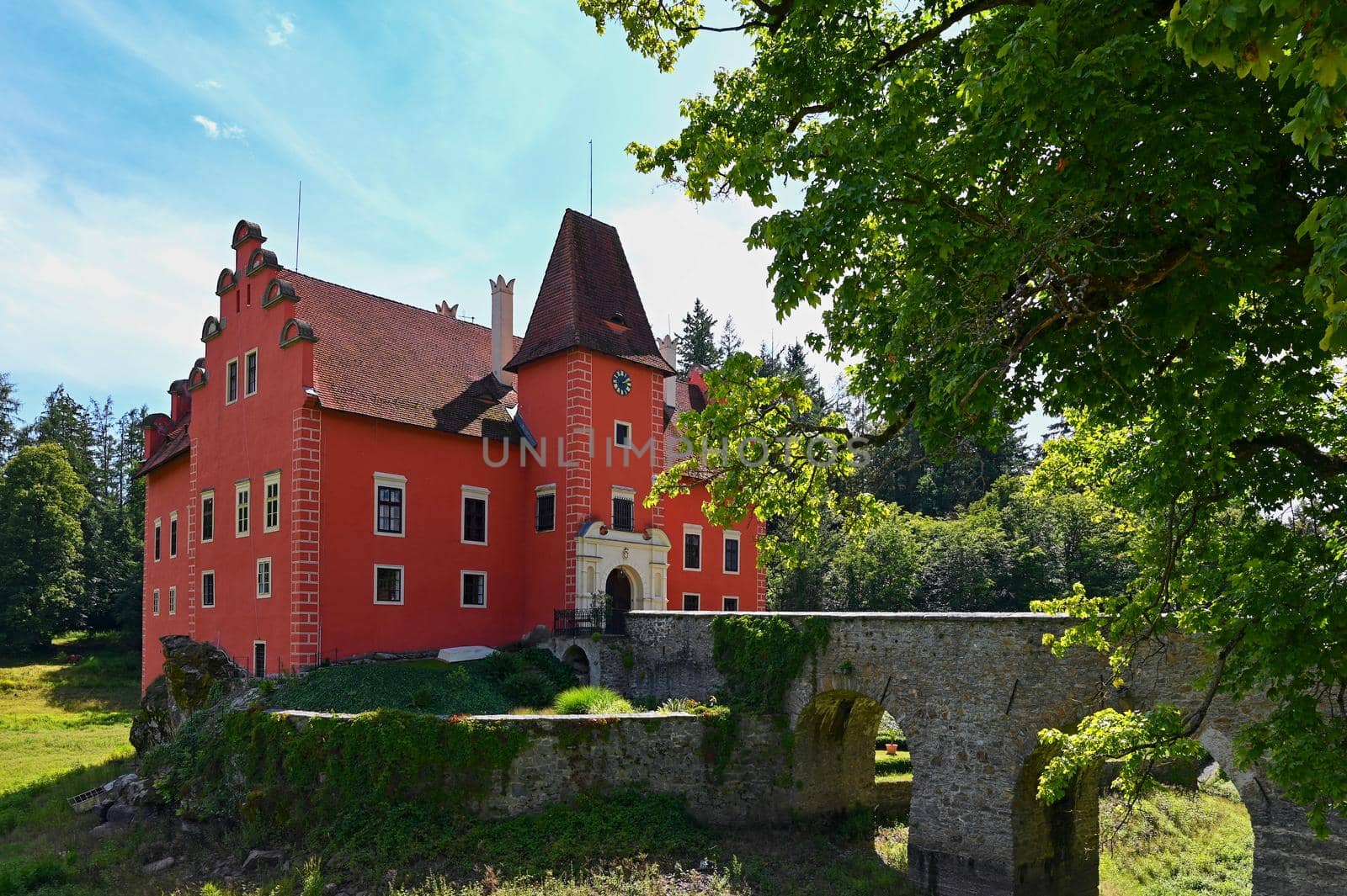 The red chateau Cervena Lhota in the the Czech Republic.
Beautiful old castle in the countryside on a summer day. Colorful nature background.