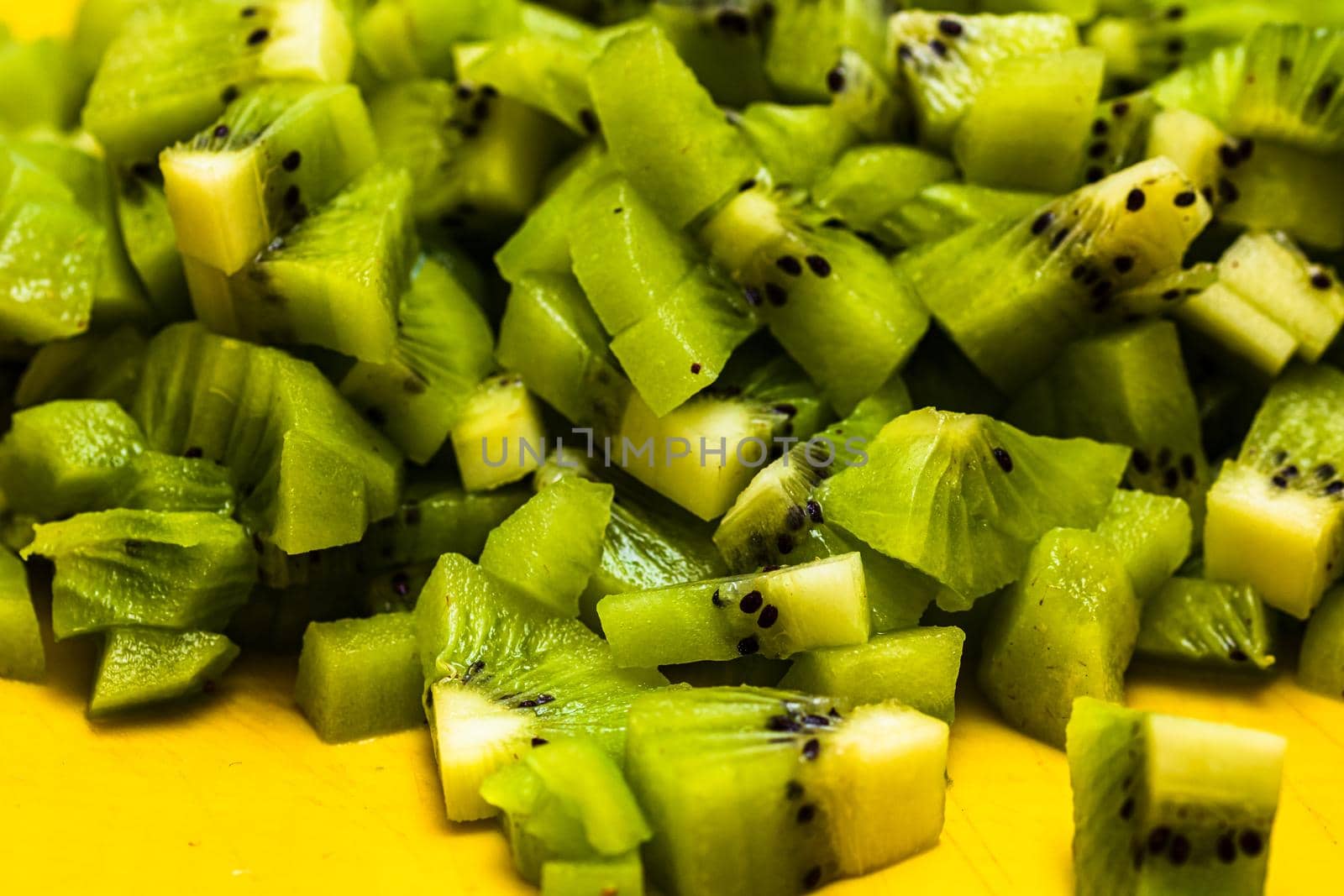 Ripe kiwi fruit. Detail of chopped exotic kiwi fruits used for desserts