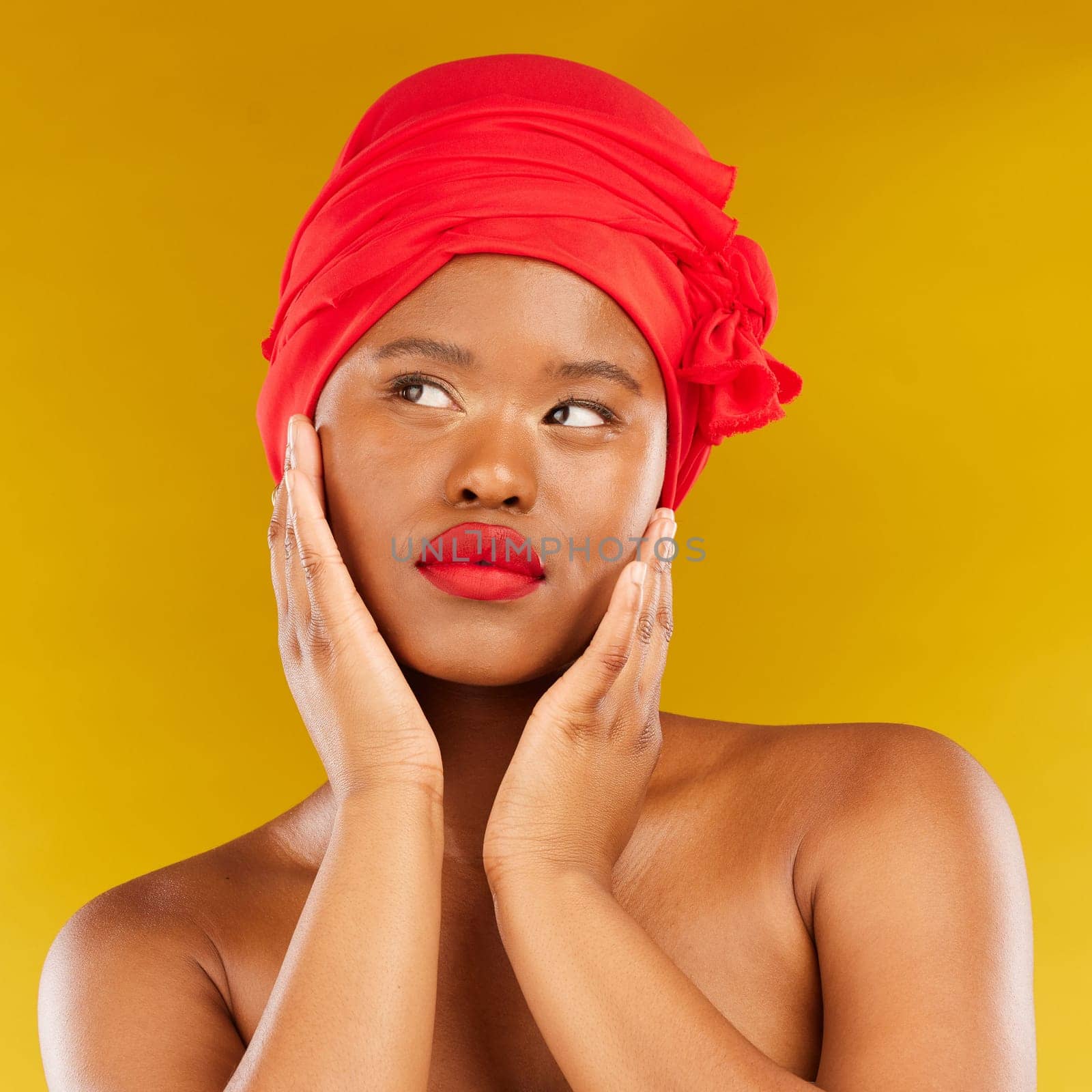 Face makeup, red lipstick and black woman with natural skincare shine, real aesthetic beauty or anti aging. Studio cosmetics, head scarf and African person touch smooth skin on yellow background by YuriArcurs