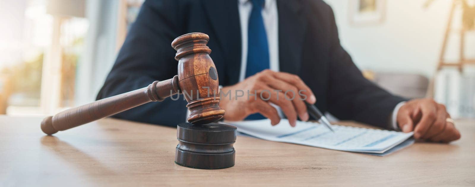 Documents, judge and gavel with hands of man in lawyer office for justice at legal hearing. Attorney, advocate and closeup of crime, hammer of person in law firm and courtroom, paperwork or signature by YuriArcurs