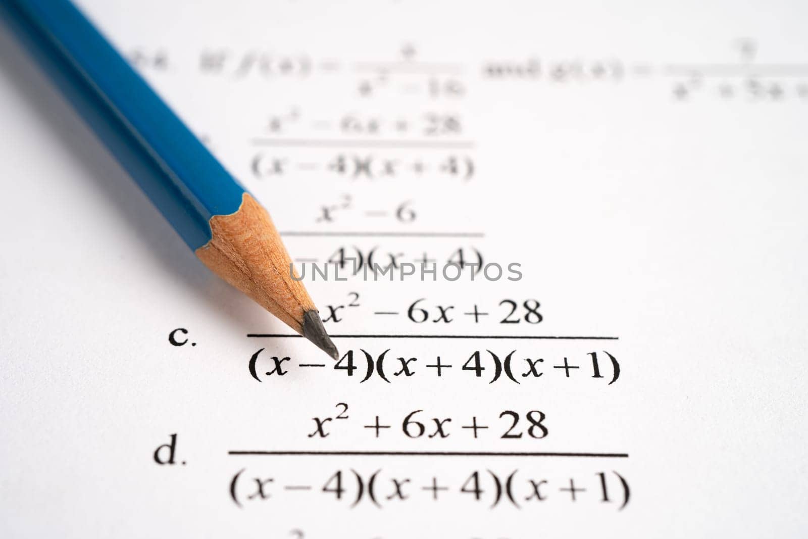 Pencil on mathematic formula exercise test paper in education school. by pamai