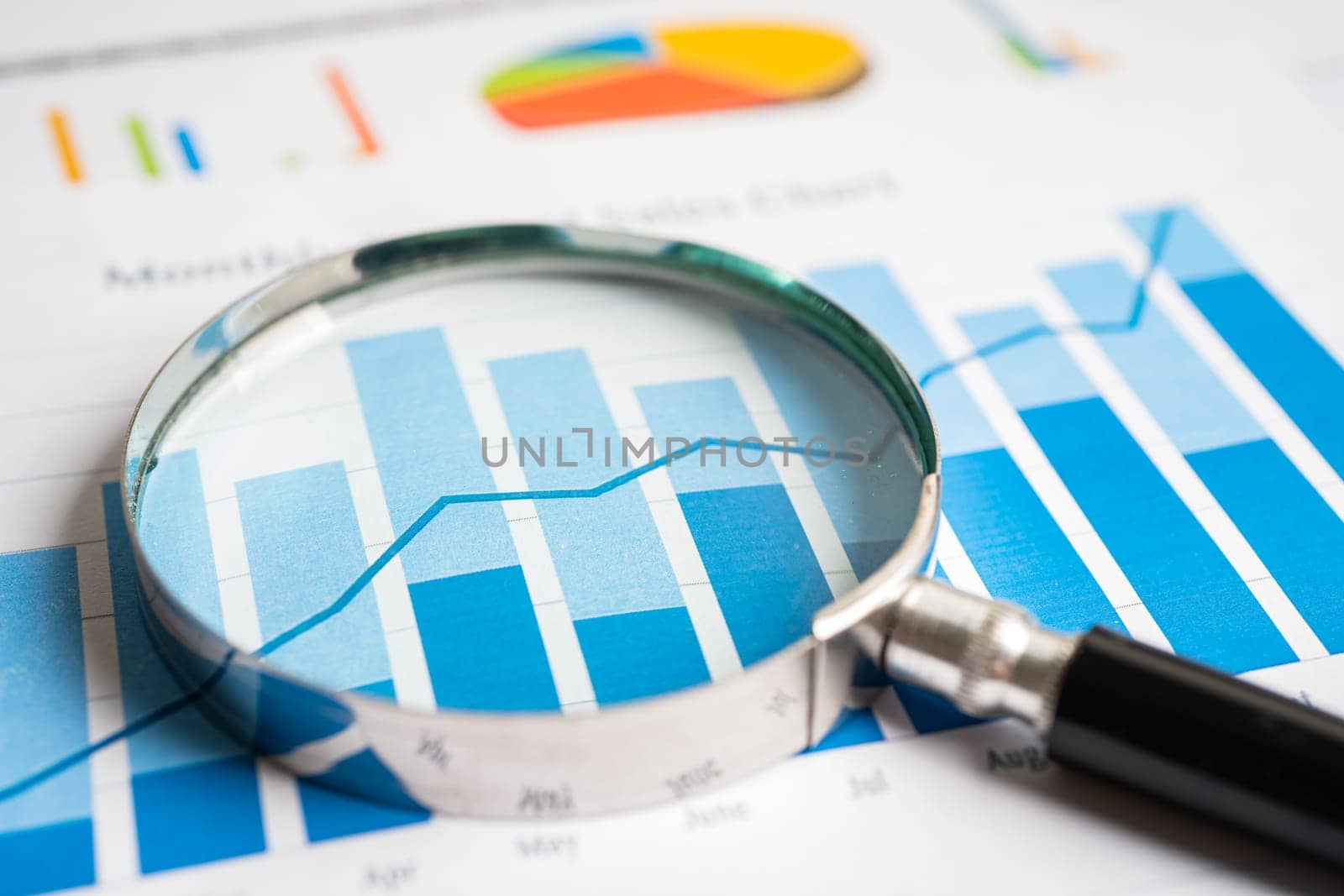 Magnifying glass on graph paper. Financial development, Banking Account, Statistics, Investment Analytic research data economy, Business concept.