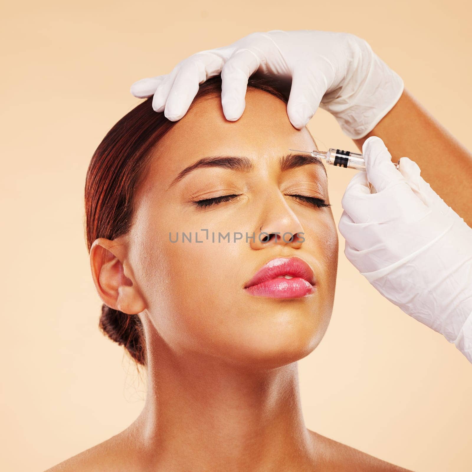 Hands, woman or plastic surgery with needle on face for cosmetics isolated on studio background. Forehead pain, anti aging or girl model with injection, dermatology and beauty with medical procedure.