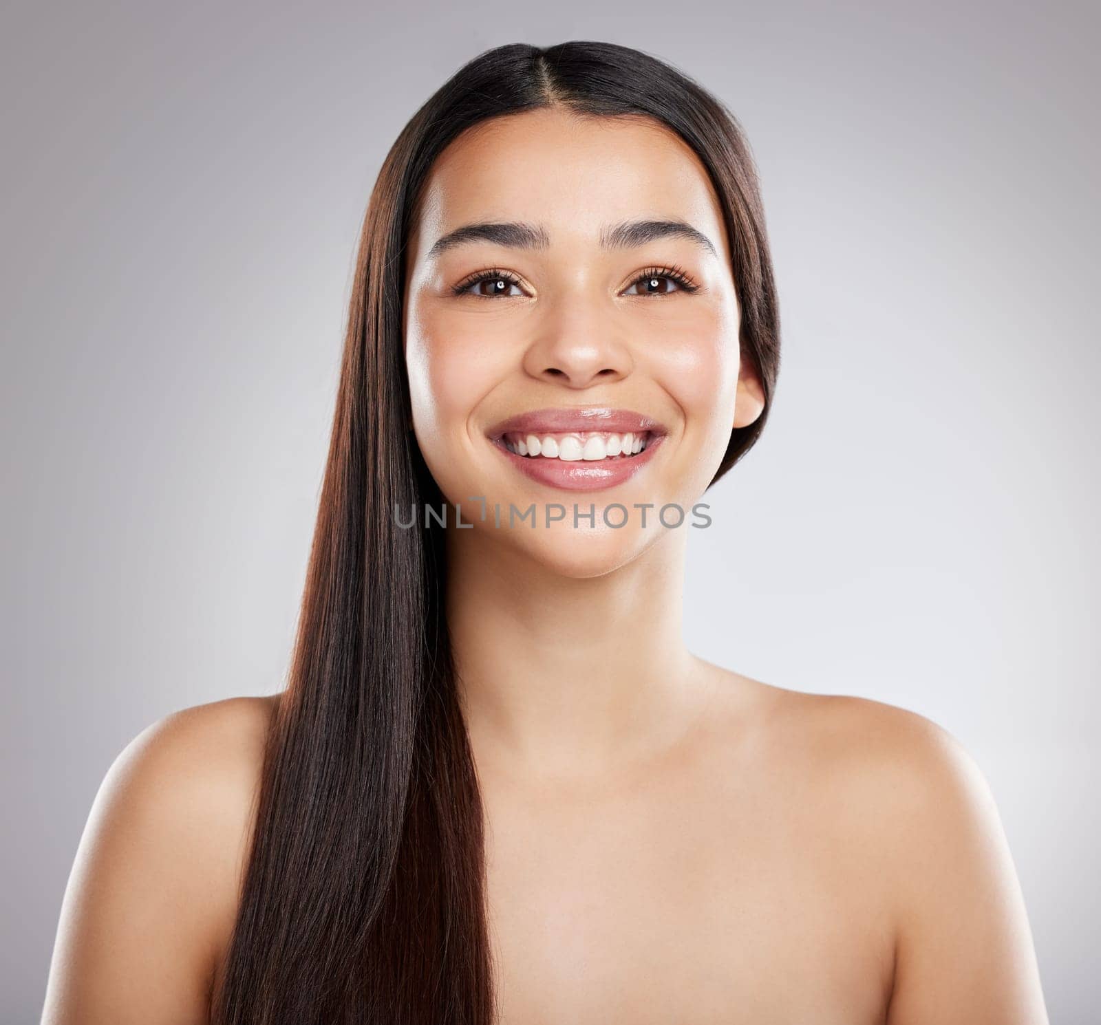 Woman in portrait, hair and beauty with hairstyle and shine, haircare and growth isolated on studio background. Female model with smile, keratin treatment and cosmetic care, texture and glossy.