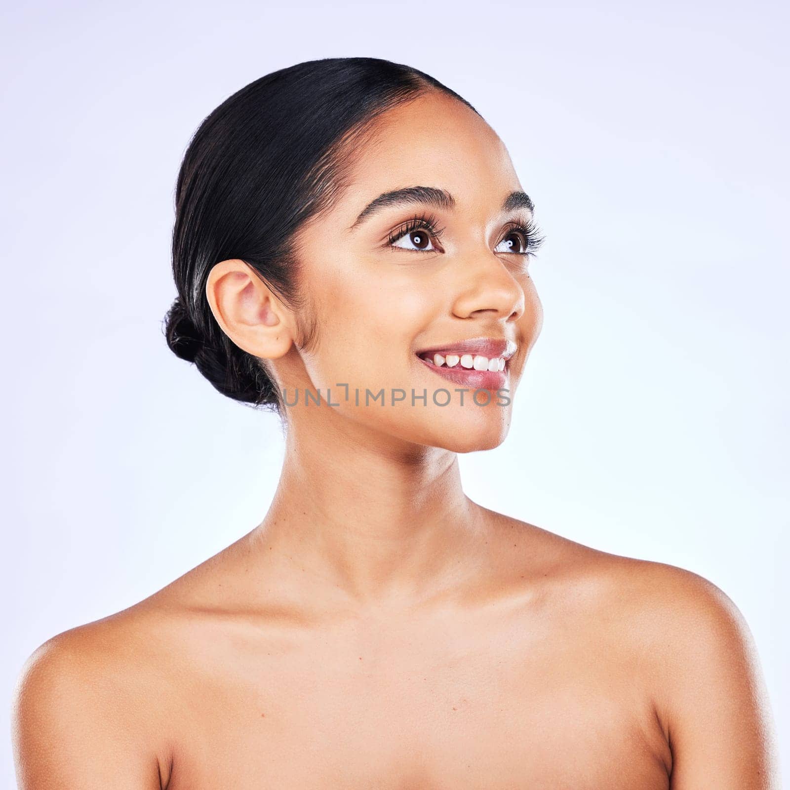 Thinking, smile and woman with skincare, dermatology and natural beauty against a white studio background. Female person, happiness and model with cosmetics, bare and ideas with health and wellness.