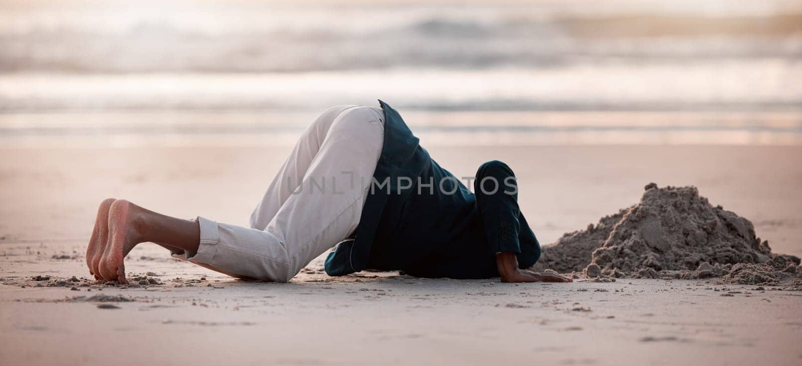 Search, digging and a man in the beach sand in nature for travel fun or holiday adventure in summer. Earth, looking and a person with a check in the ground at the ocean for treasure on vacation.