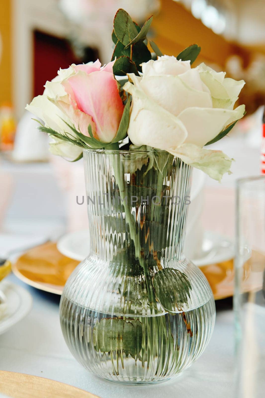 Composition of fresh flowers on a festive wedding table. Elegance wedding decor. Selective focus.