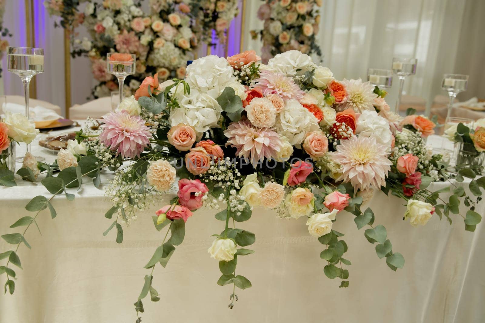 Beautiful tenderless bouquet on wedding table. Elegance wedding decor.
