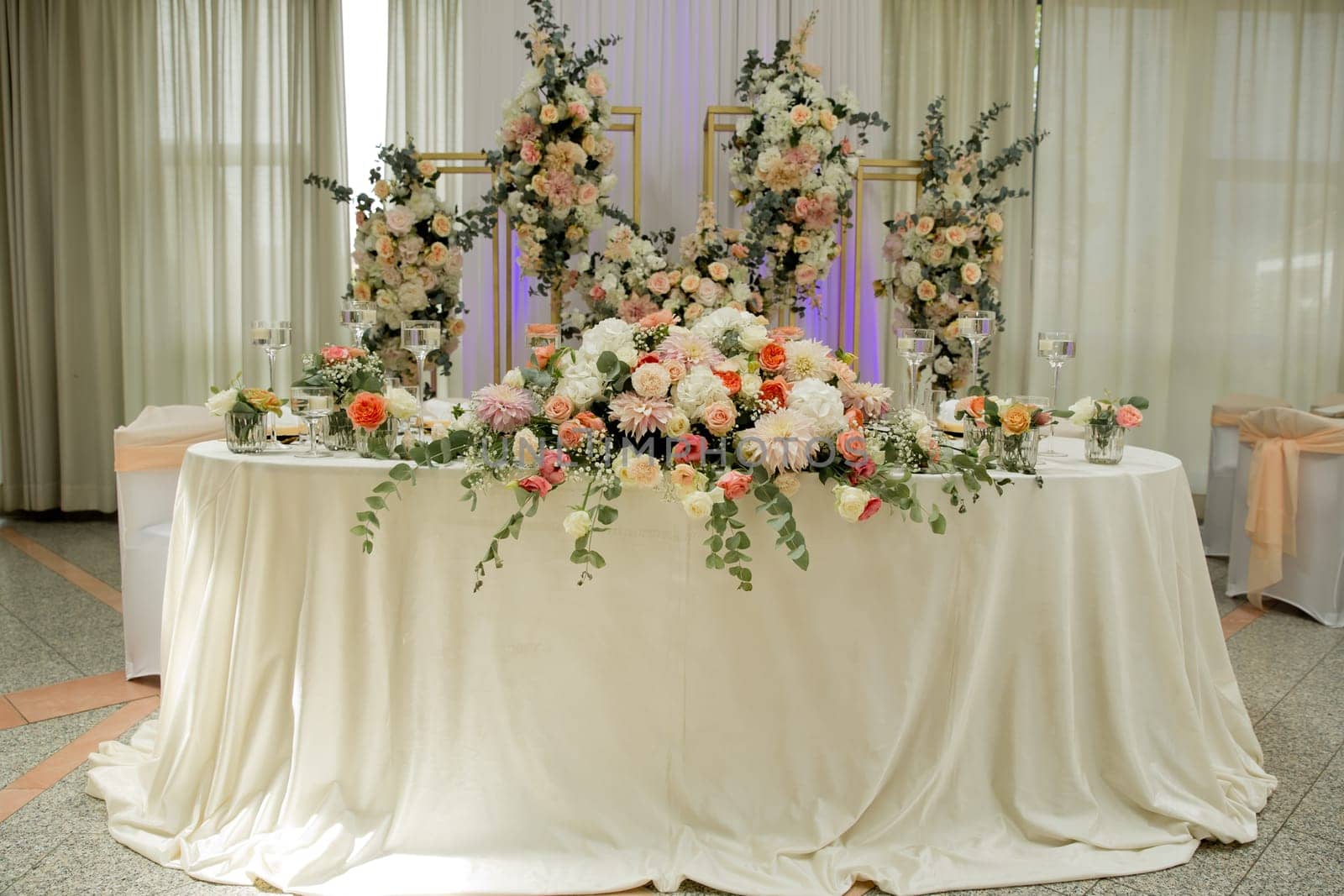 Wedding table with favors and flowers. Elegance wedding decor.