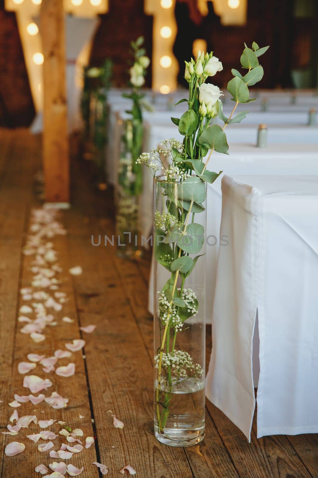 Composition of natural flowers in a glass vases on the floor. Selective focus.