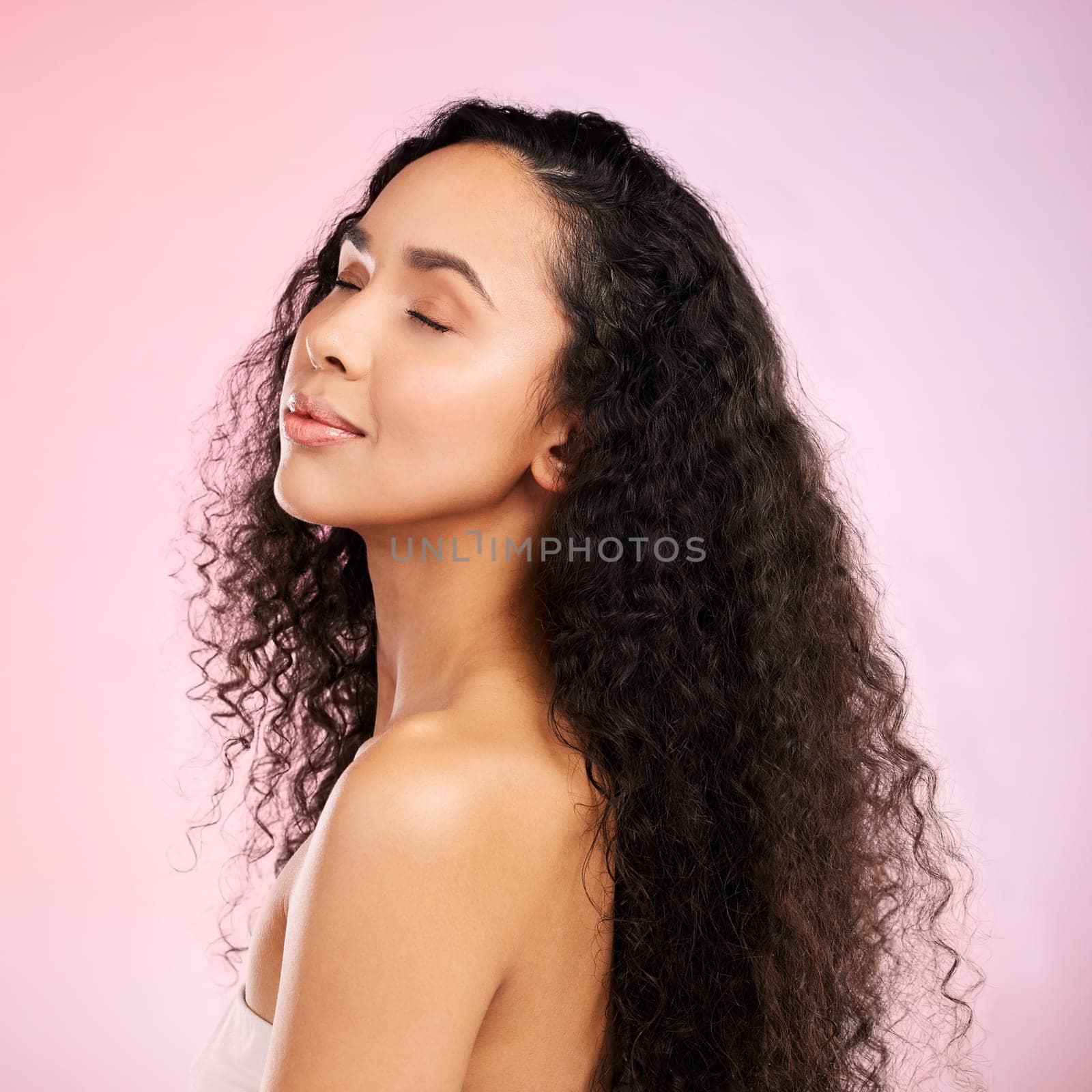 Beauty, skincare and african girl with glow on body in studio or isolated and pink background for luxury treatment. Natural, face and female person with hairstyle for healthy shine with spa facial. by YuriArcurs