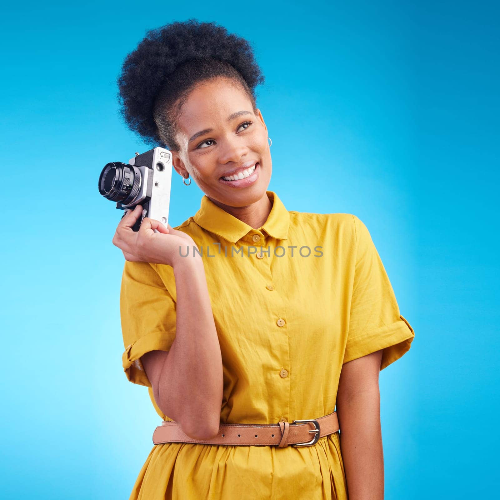 Photography, smile and black woman with camera isolated on blue background, creative artist job and talent. Art, face of happy photographer with hobby or career in studio on travel holiday photoshoot.