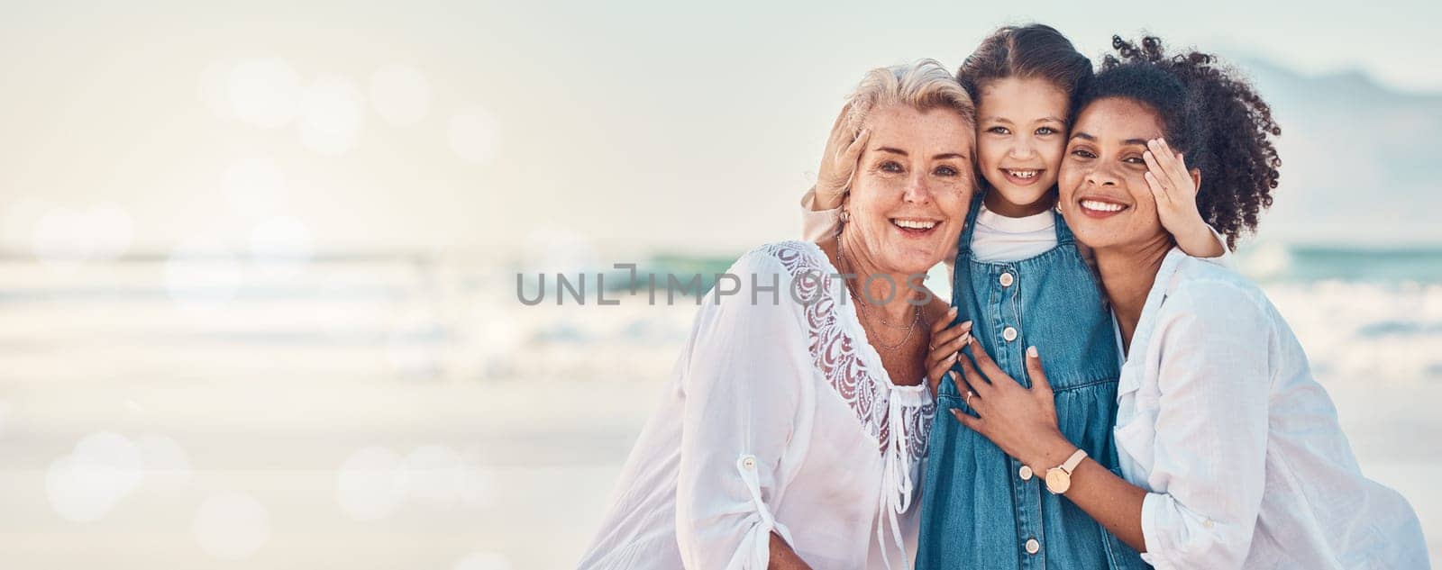 Portrait of a mother, grandmother and child at the beach while on family vacation, holiday or adventure. Senior woman, mom and girl kid together outdoor for summer fun and travel with bokeh and space.