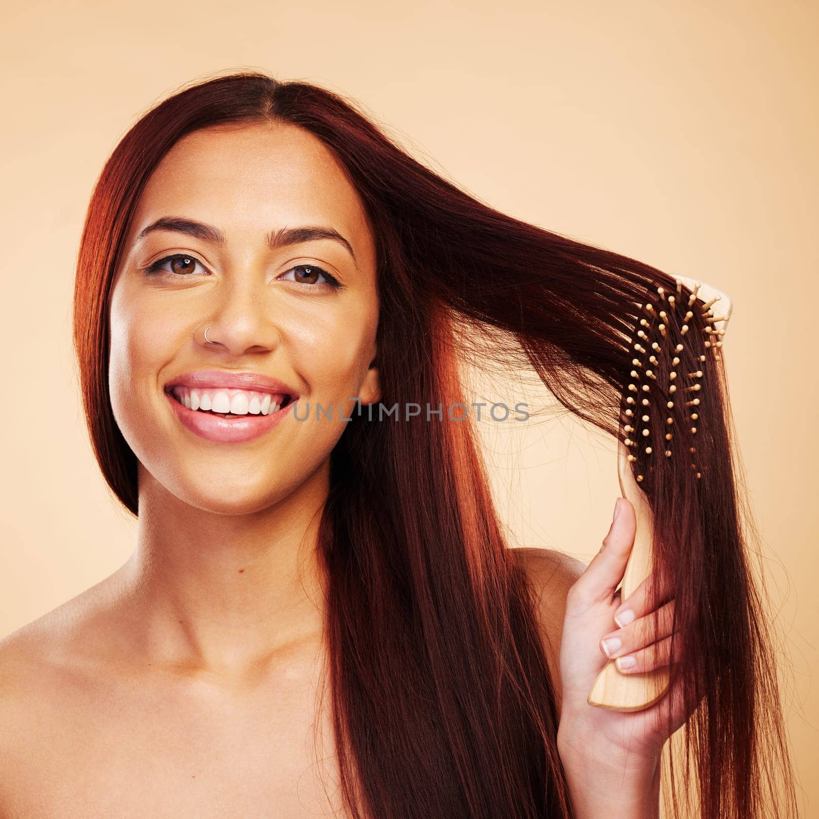 Hair care, beauty and portrait of happy woman with brush, luxury salon treatment and brown background. Smile, haircut and natural haircare, face of model with cosmetics and keratin shine in studio