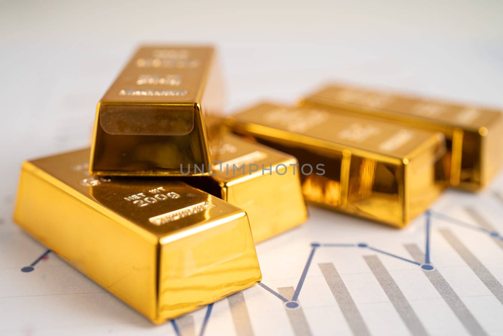 Gold bar on graph, economy finance exchange trade investment concept.