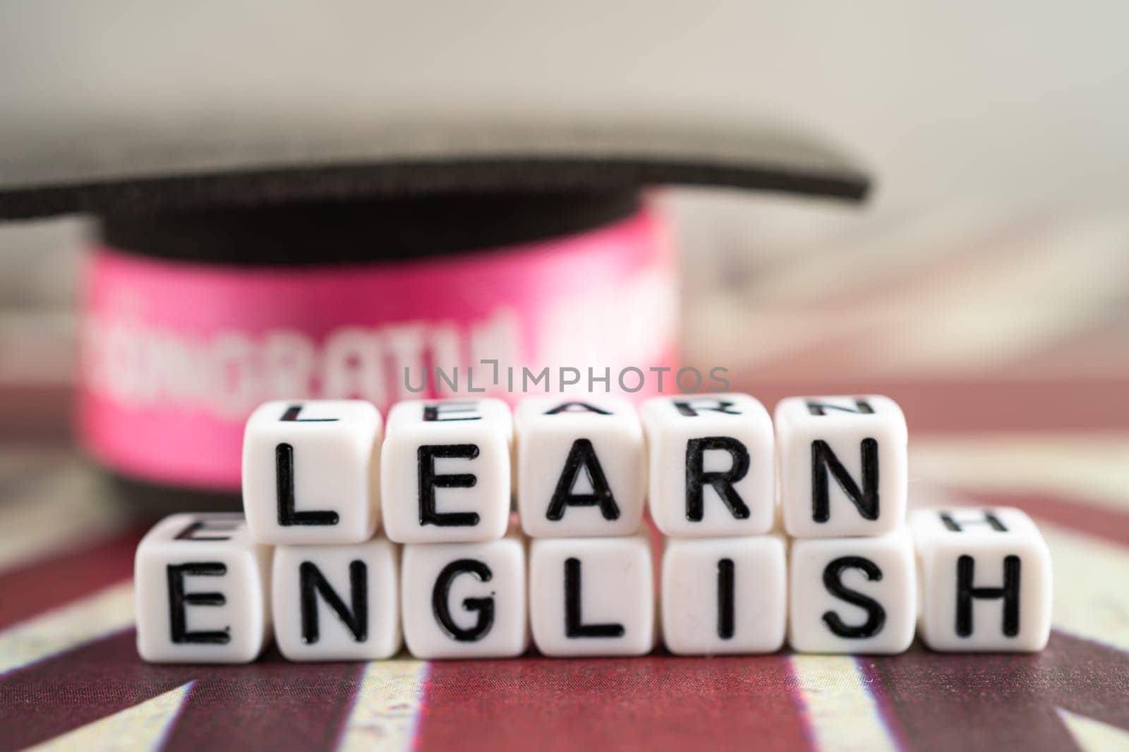Word Learn English on book with United Kingdom flag, learning English language courses concept. by pamai