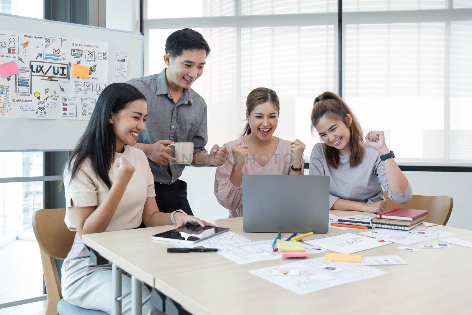 Asian office team brainstorming, plan for solution idea, Group of asia creative teamwork and woman leader at business meeting for developing mobile phone app, ux, ui start up, small business.