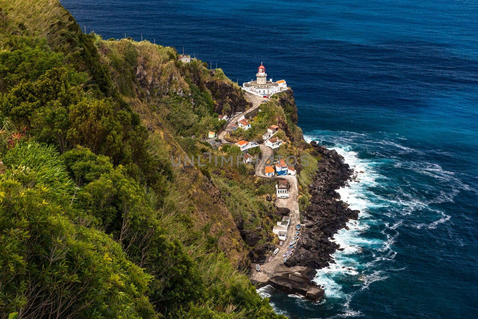 A panoramic view of the Nordeste lighthouse directly on the cliffs of the Azores island of Sao Miguel, Portugal