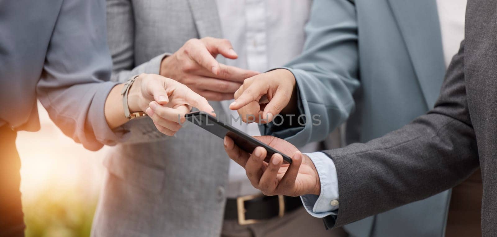 Business people, phone and hands pointing outdoor to social media and networking app. Group, technology and employee mobile blog with online communication and digital check on company website by YuriArcurs