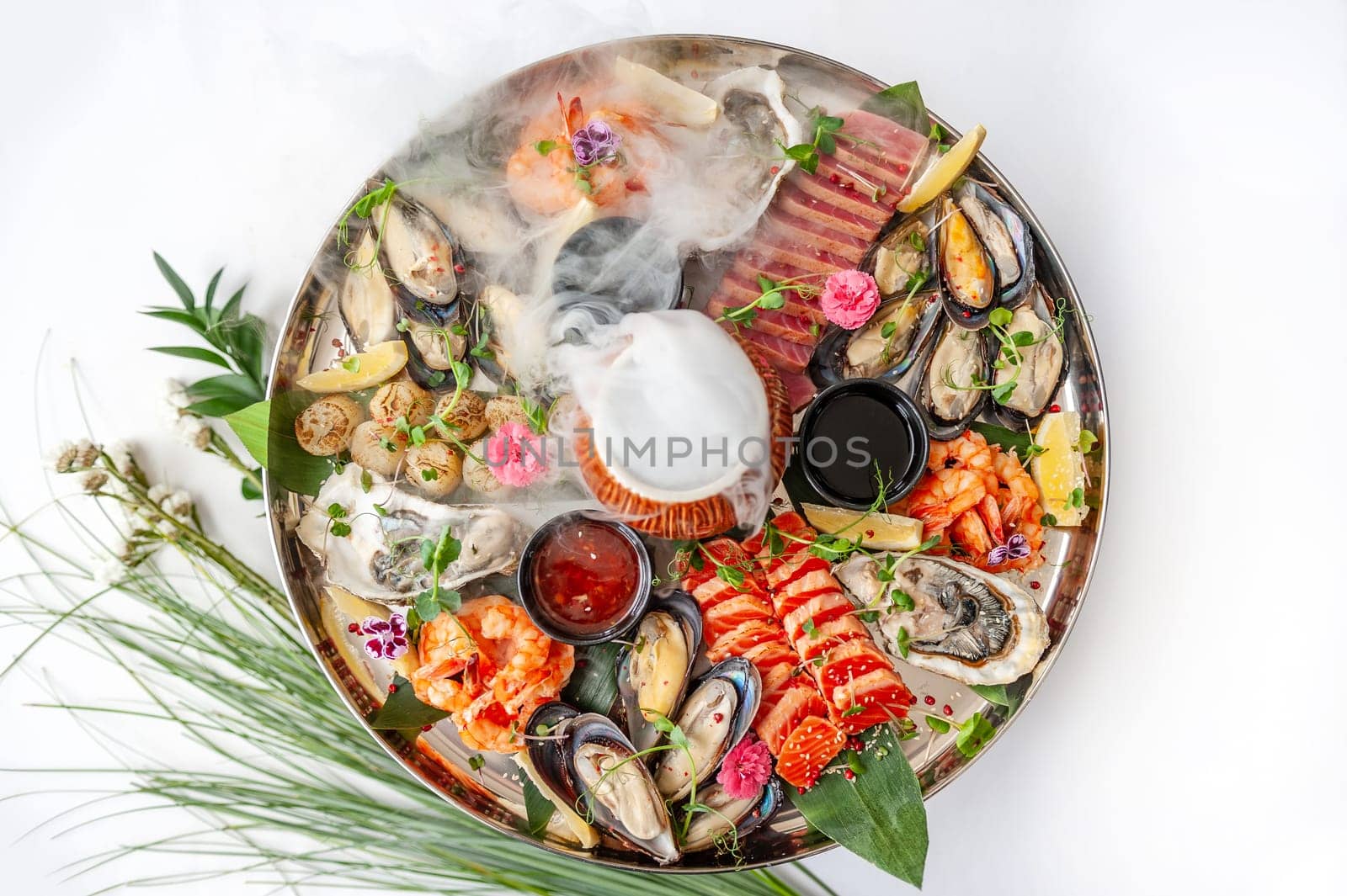 Fresh seafood plate with, mussels, oysters, scallop, salmon and tuna