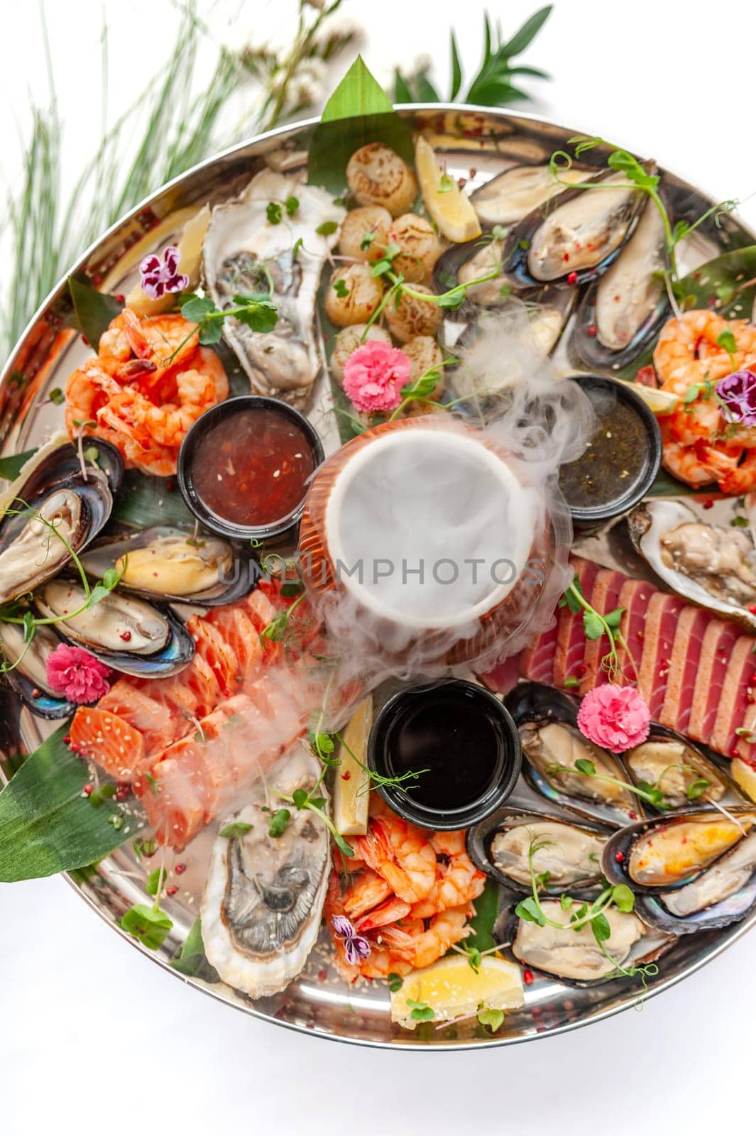 Fresh seafood plate with, mussels, oysters, scallop, salmon and tuna