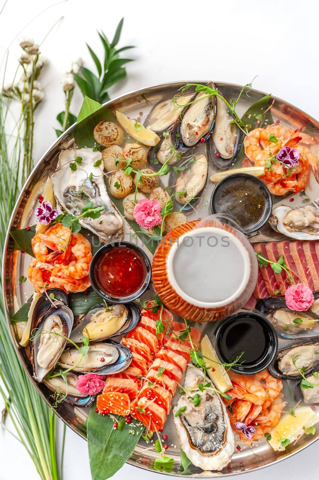 Fresh seafood plate with, mussels, oysters, scallop, salmon and tuna