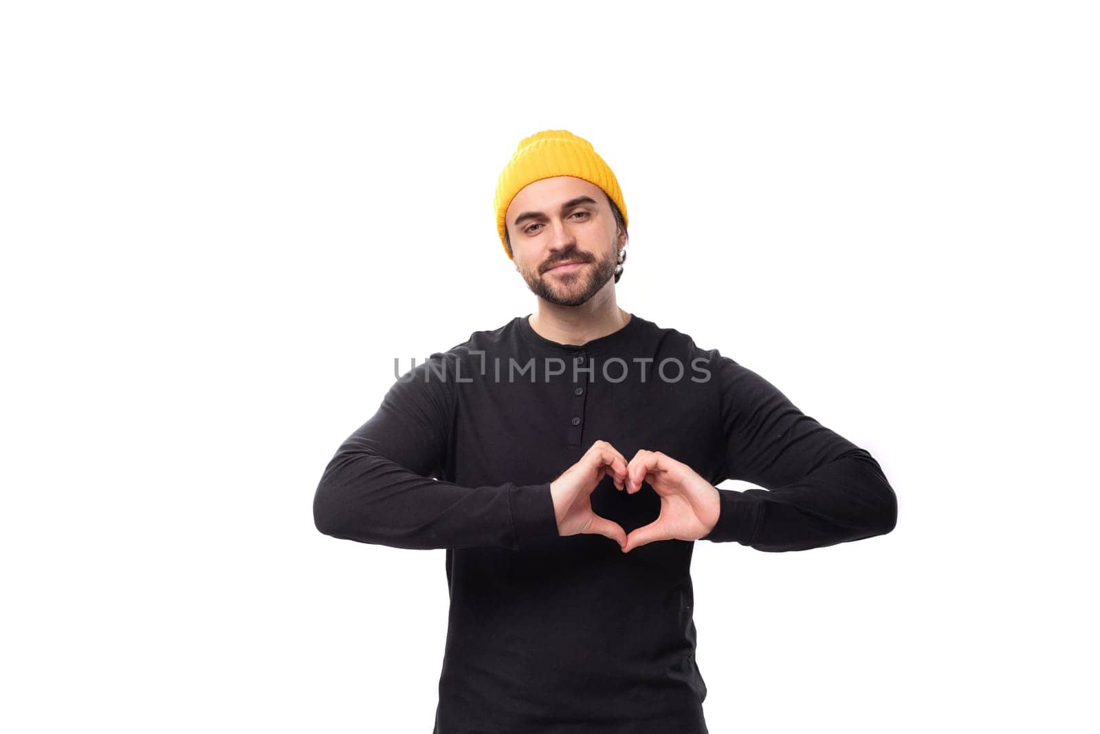 young friendly caucasian brunette man with beard in casual sweatshirt.