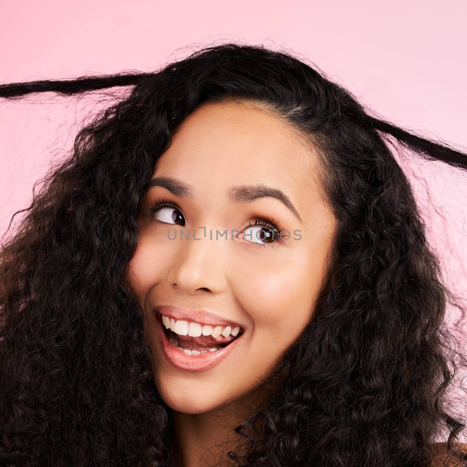 Beauty, curly hair and smile with face of woman in studio for cosmetics, textures and salon treatment. Shampoo, skincare and hairstyle with model on pink background for self care, facial and glow.