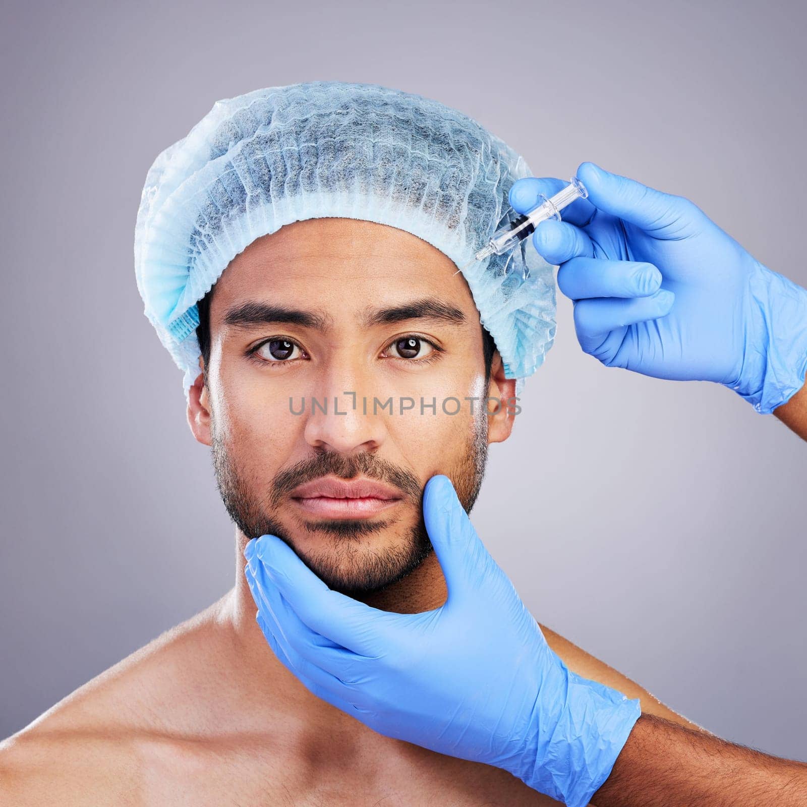 Hands, portrait and transformation with a man in studio on a gray background for an injection. Face, beauty and plastic surgery with a male customer in a clinic for antiaging filler or cosmetics.