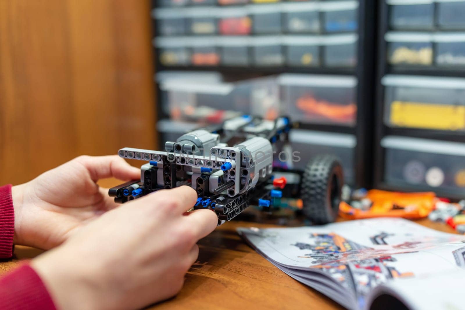 Boy playing with developing kit for young engineers