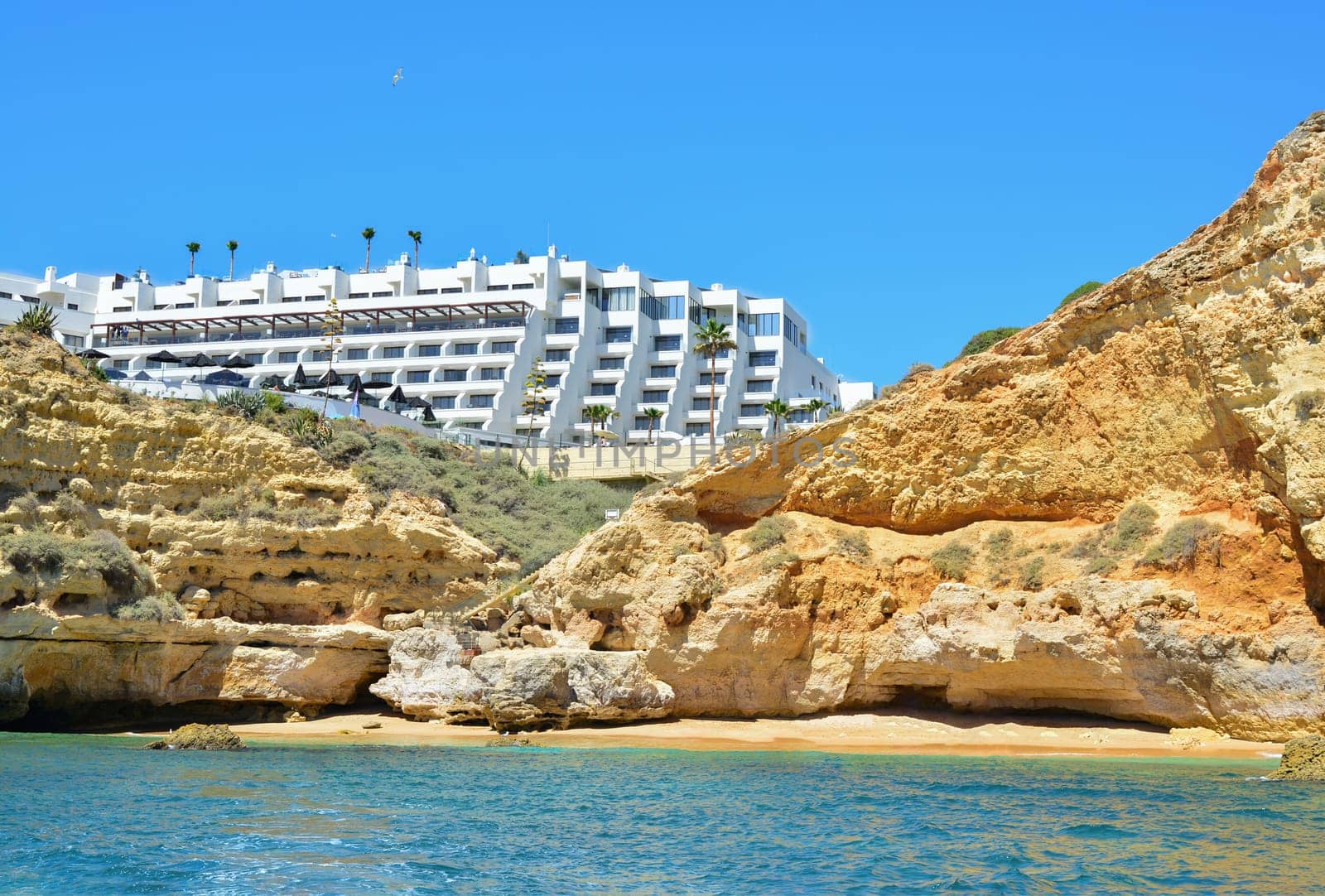 Wild beach under the rocks in the south of the Portuguese region Algarve